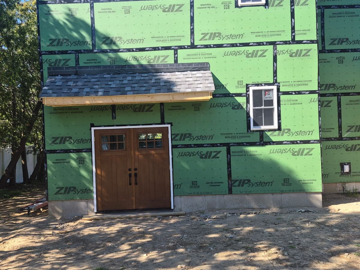 Two-story custom home with ZIP System sheathing and a craftsman entry