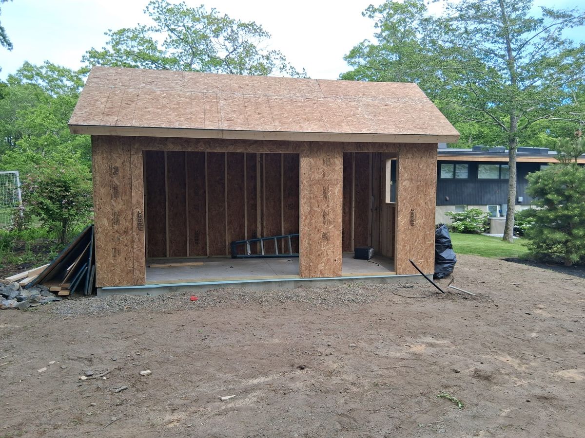Framed backyard shed and accessory building with sheathing